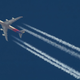 Stock photo of airplane with contrails